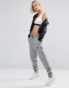 Серые стеганые спортивные штаны Nike Rally - Серый