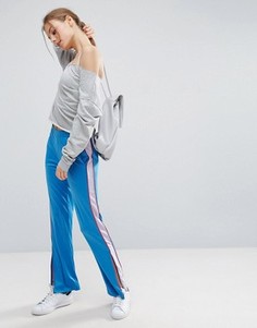 Спортивные штаны с контрастными полосками и молниями ASOS - Синий