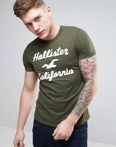Узкая футболка оливкового цвета с крупным логотипом Hollister - Зеленый