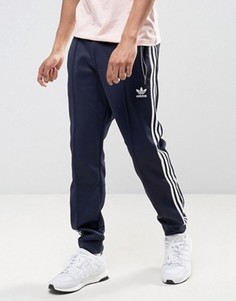 Синие джоггеры с манжетами adidas Originals London Pack BK7877 - Синий