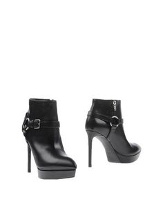 Полусапоги и высокие ботинки Saint Laurent