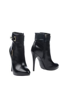 Полусапоги и высокие ботинки Guess