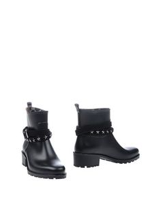 Полусапоги и высокие ботинки Guess