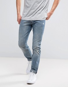 Эластичные джинсы слим с рваной отделкой Wrangler Larston - Синий