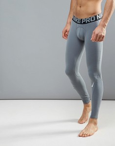 Серые спортивные компрессионные колготки Nike Pro Warm 725039-065 - Серый
