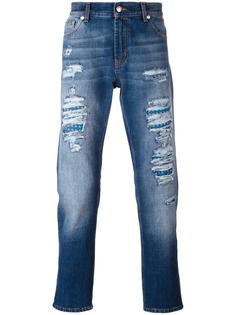 джинсы с рваными деталями   Alexander McQueen