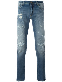 джинсы с рваными деталями Dolce & Gabbana