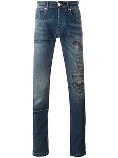джинсы с рваными деталями Pierre Balmain