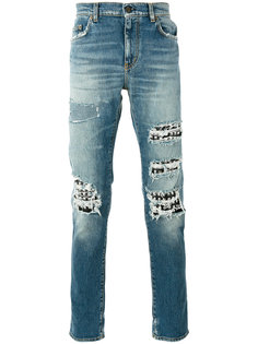 рваные джинсы с заклепками Saint Laurent