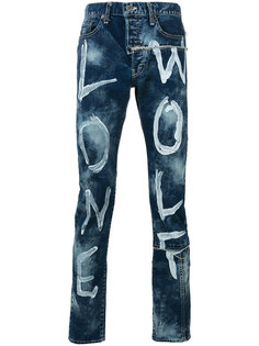 джинсы с имитацией надписей красками Maison Mihara Yasuhiro