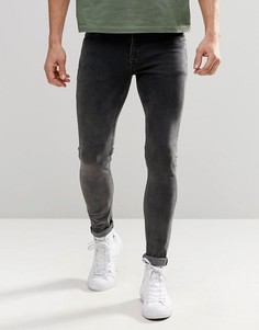 Супероблегающие джинсы с эффектом кислотной стирки ASOS - Черный