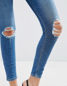 Темные выбеленные джинсы скинни с рваными коленями ASOS RIDLEY - Синий