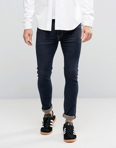 Зауженные джинсы цвета индиго с контрастными строчками Levis 519 - Темно-синий