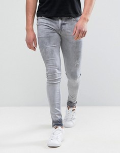 Светло-серые супероблегающие джинсы с потертостями ASOS - Серый