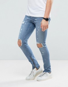 Супероблегающие джинсы с рваной отделкой, молниями по бокам и эффектом кислотной стирки New Look - Синий