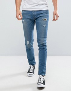 Эластичные джинсы скинни с рваной отделкой Hollister - Синий