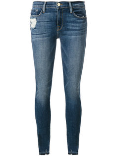 джинсы скинни с рваными деталями Frame Denim