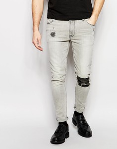 Супероблегающие джинсы с принтом в области колена ASOS - Серый