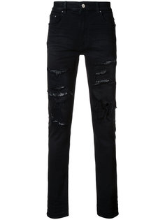 джинсы с потертой отделкой Amiri