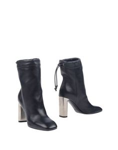 Полусапоги и высокие ботинки CÉline