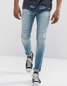 Выбеленные синие супероблегающие джинсы с рваной отделкой и накладками ASOS - Синий
