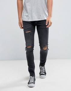 Черные джинсы скинни с рваной отделкой River Island - Черный