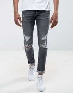 Черные джинсы скинни с рваной отделкой River Island - Черный