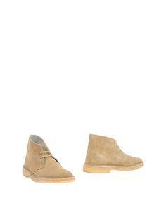 Полусапоги и высокие ботинки Clarks