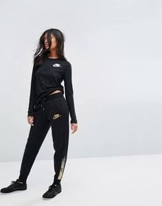 Спортивные штаны классического кроя с логотипом цвета металлик Nike Rally - Мульти