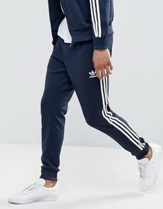 Спортивные штаны с манжетами adidas Originals Superstar AJ6961 - Темно-синий