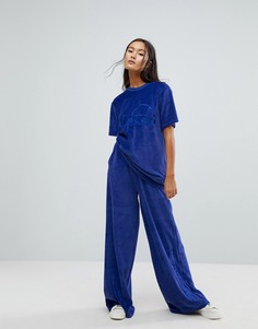 Широкие велюровые спортивные штаны из комплекта Ellesse - Темно-синий