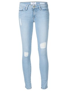 джинсы с рваными деталями Frame Denim