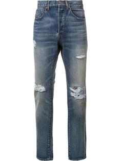 джинсы с рваными деталями 321