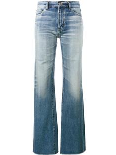 расклешенные джинсы с необработанными краями Saint Laurent