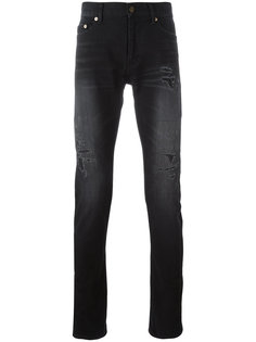 джинсы с потертой отделкой Saint Laurent