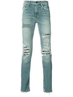 джинсы с эффектом потертости Saint Laurent
