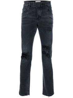 джинсы с выцветшим эффектом и эффектом рванины Pierre Balmain
