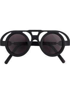 солнцезащитные очки в оправе с вырезными деталями Kuboraum