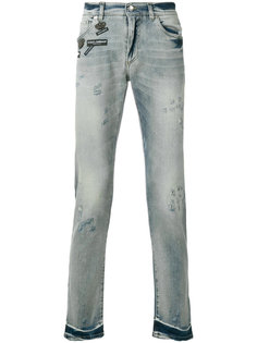 джинсы с заплатками Dolce & Gabbana