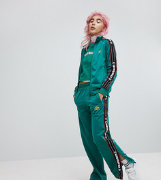 Комбинируемые спортивные штаны с отделкой лентой Umbro - Зеленый