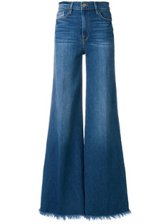 расклешенные джинсы с бахромой Frame Denim