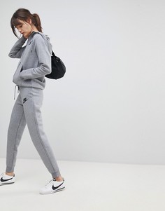 Серые спортивные штаны узкого кроя Nike Rally - Серый