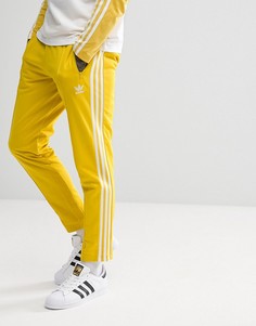Желтые джоггеры скинни adidas Originals adicolor Beckenbauer CW1273 - Желтый