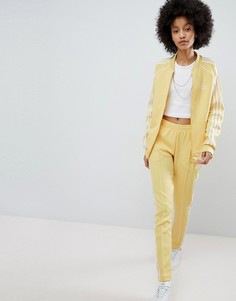 Желтые спортивные штаны с тремя полосами adidas Originals adicolor - Желтый