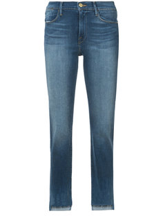 джинсы узкого кроя с асимметричным низом Frame Denim