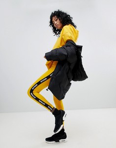 Оранжевые леггинсы с фирменной лентой Ivy Park Active - Оранжевый