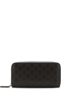 Кожаное портмоне на молнии с тиснением Signature Gucci