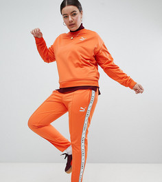 Оранжевые спортивные штаны с полосками по бокам Puma эксклюзивно для ASOS Plus - Оранжевый