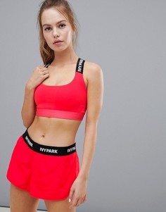 Красный спортивный бюстгальтер в полоску с отделкой фирменной лентой Ivy Park - Красный