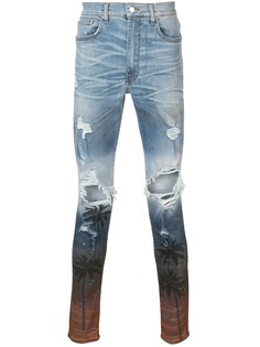джинсы скинни с рваными деталями Amiri